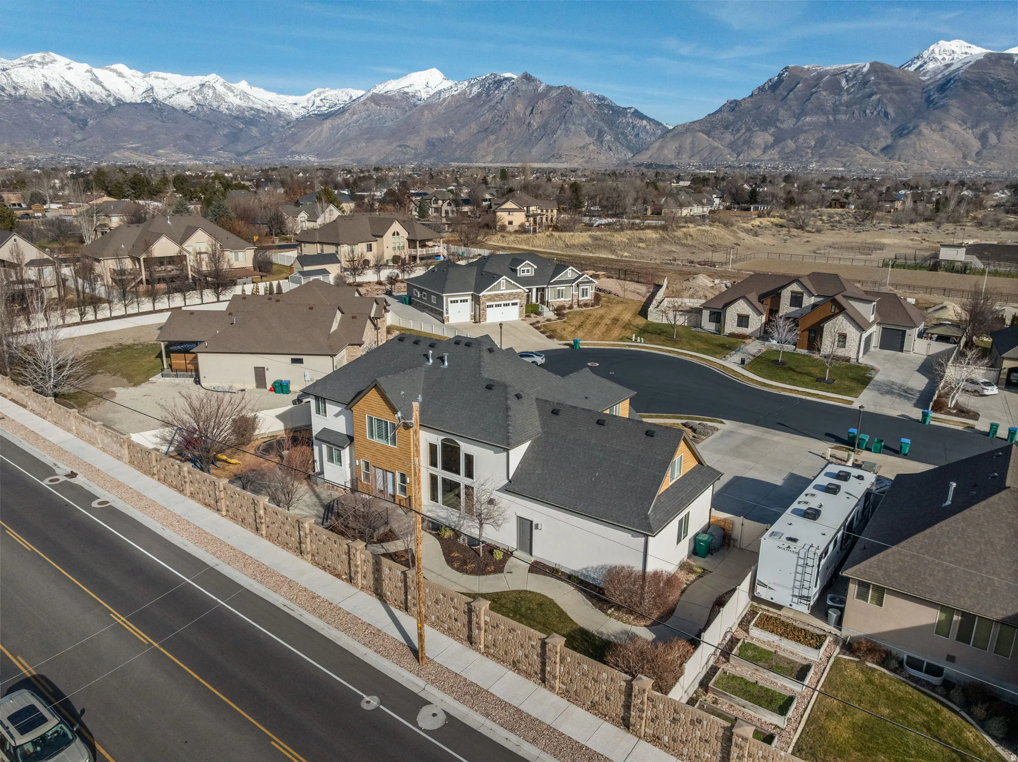 Aerial view of residential area featuring mountains