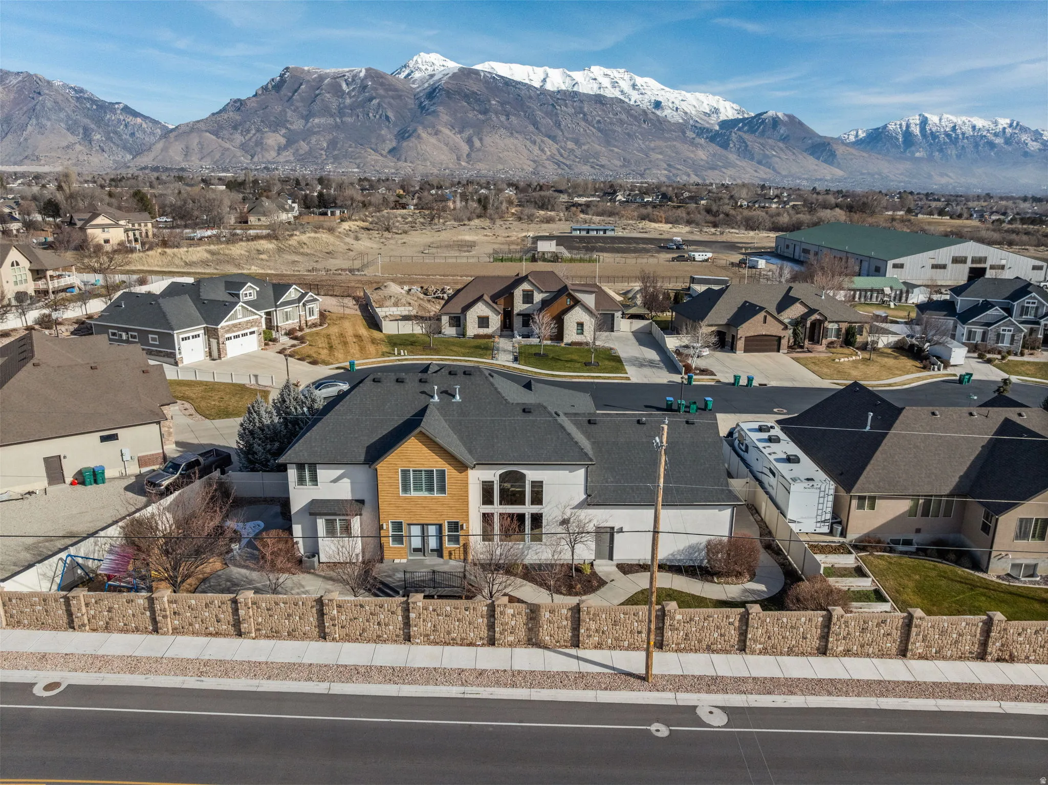 Aerial view of residential area featuring a mountainous background