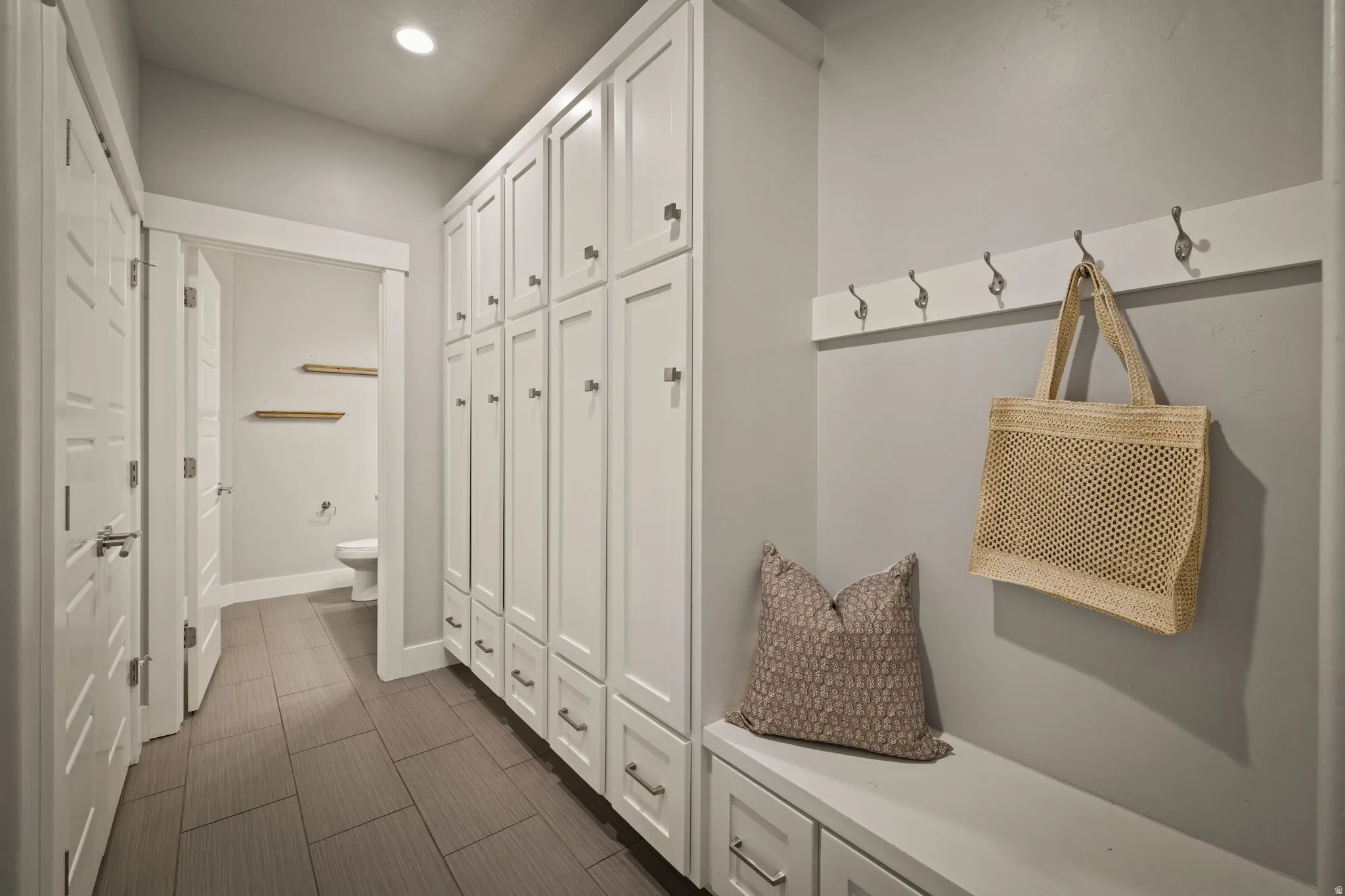 Mudroom featuring recessed lighting and baseboards