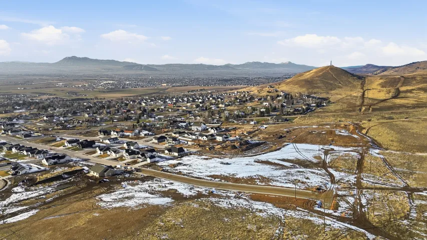 Aerial view of residential area featuring mountains