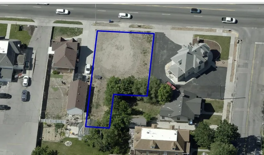 Aerial perspective of suburban area with property boundaries highlighted