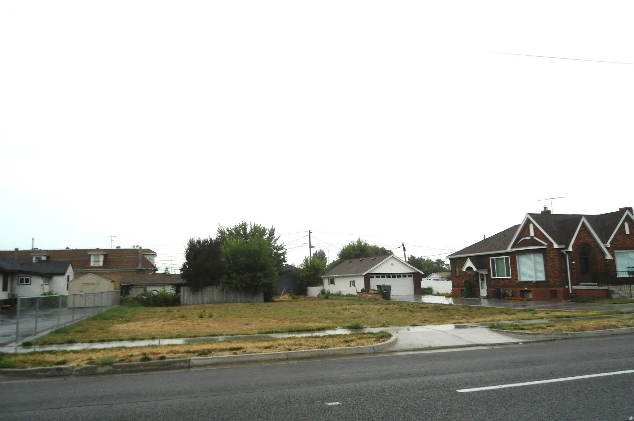 View of front of house featuring a residential view and a detached garage
