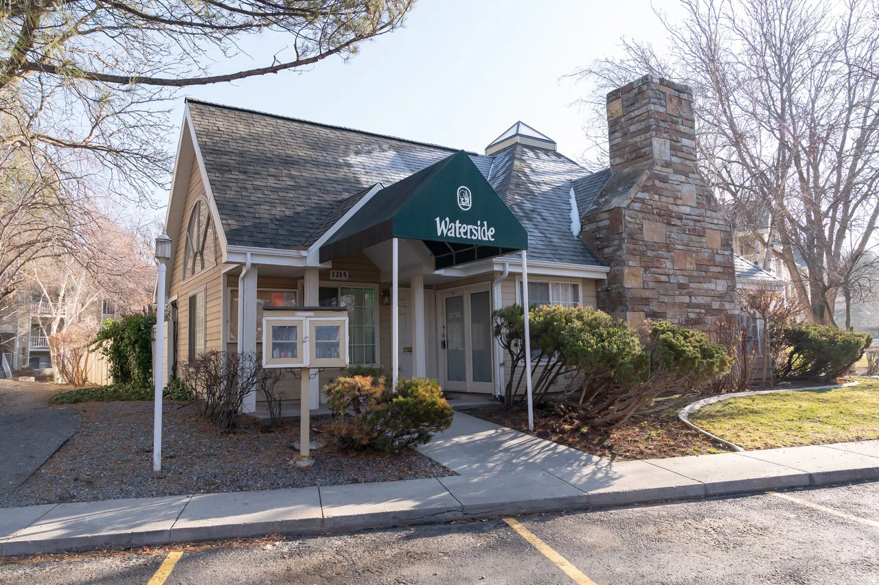 Front of the clubhouse with a small community library on the exterior.