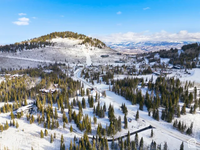 Snowy aerial view with a mountain view