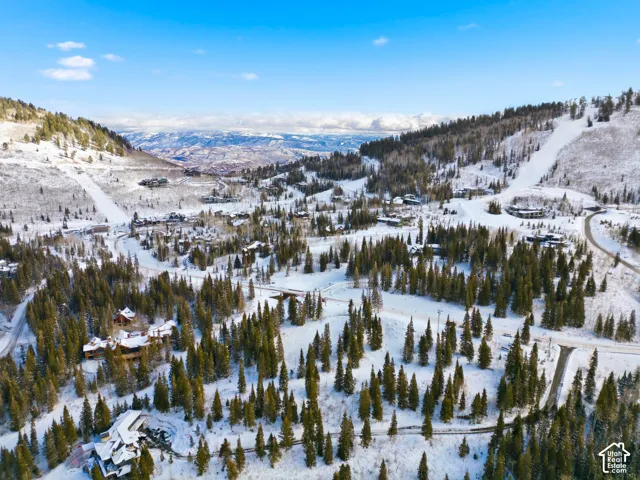 Snowy aerial view with a mountain view