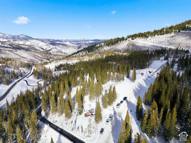 Snowy aerial view featuring a mountain view