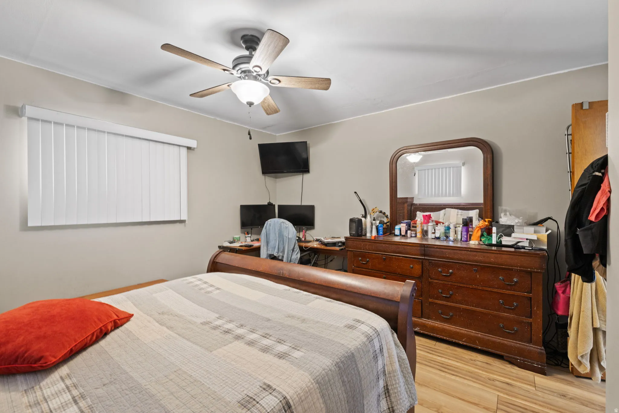 Bedroom featuring a ceiling fan and light wood-style floors