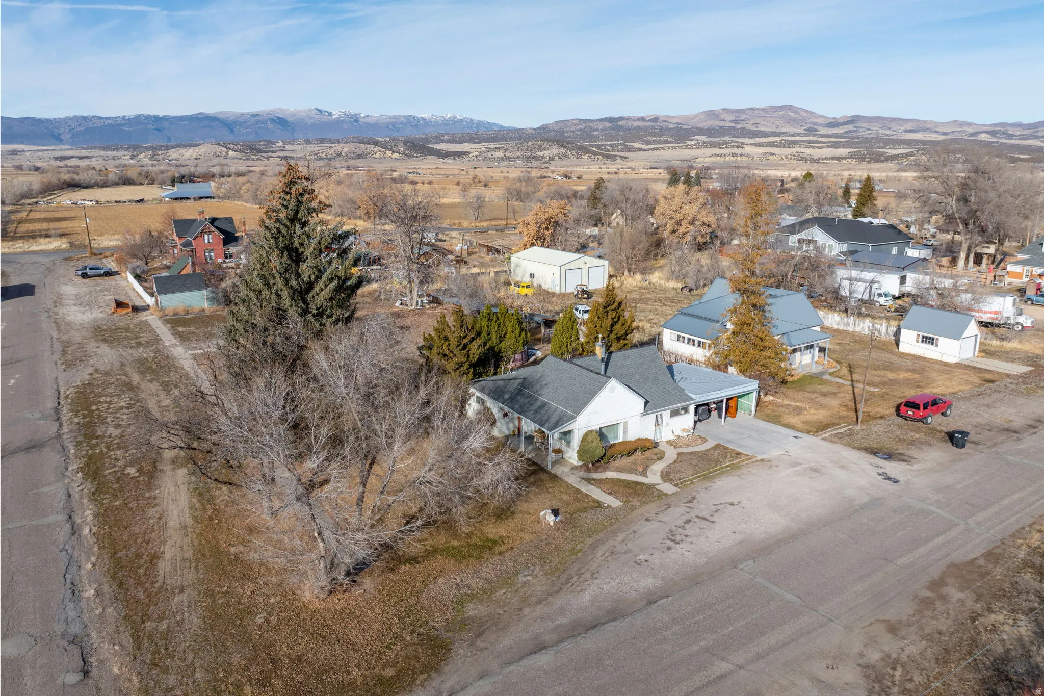 Aerial view of residential area featuring a mountainous background