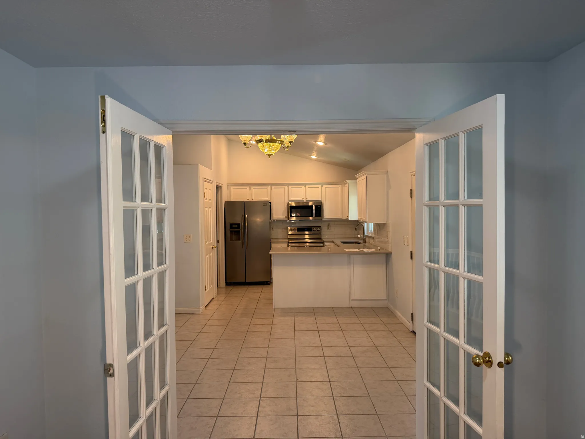 French Doors into this room make it a great home office or library.  This room is off the kitchen.