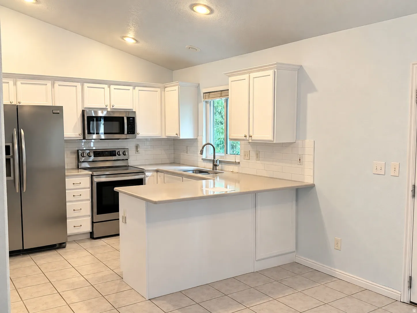 Stainless Steel Appliances and Quartz countertops in the kitchen.