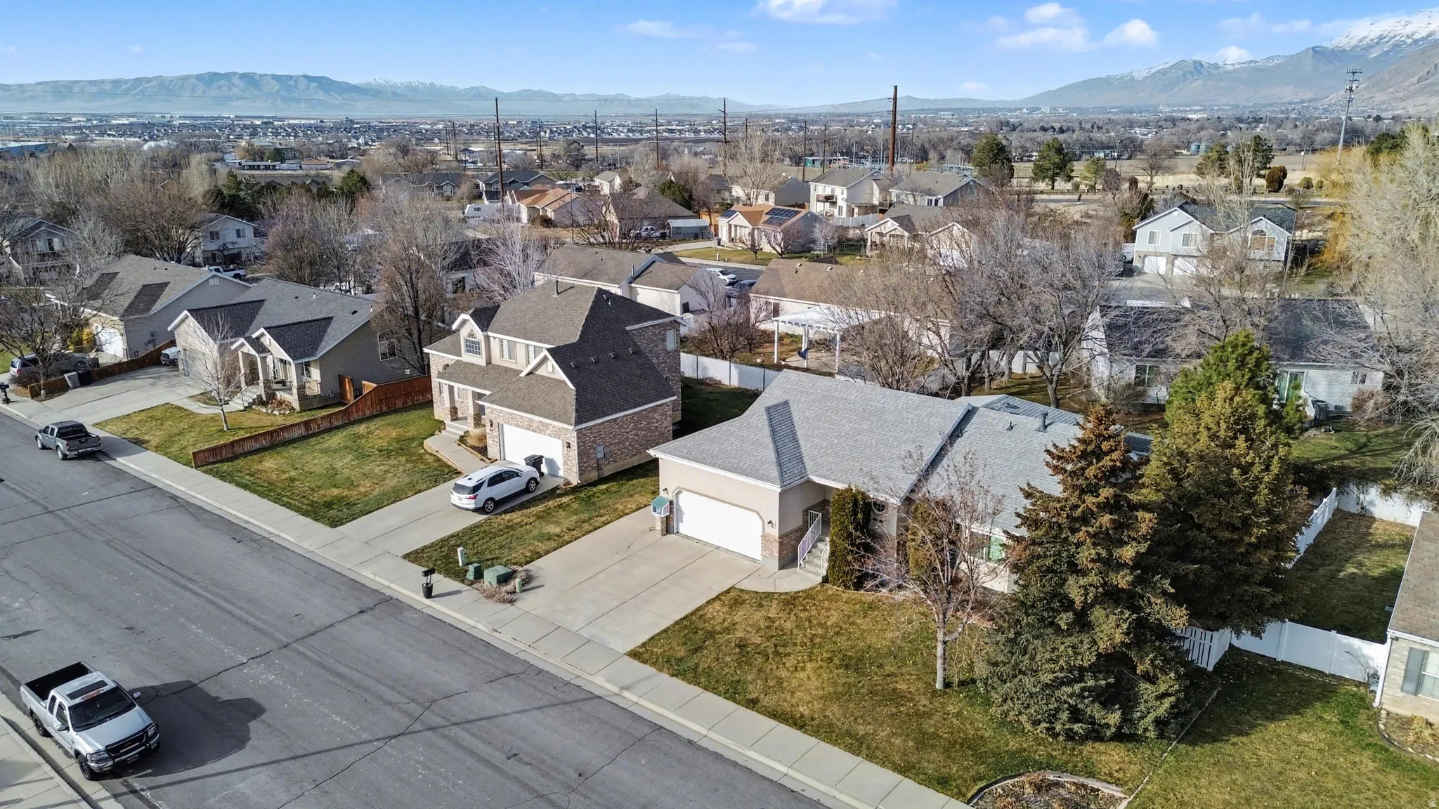 Aerial view of residential area featuring a mountainous background