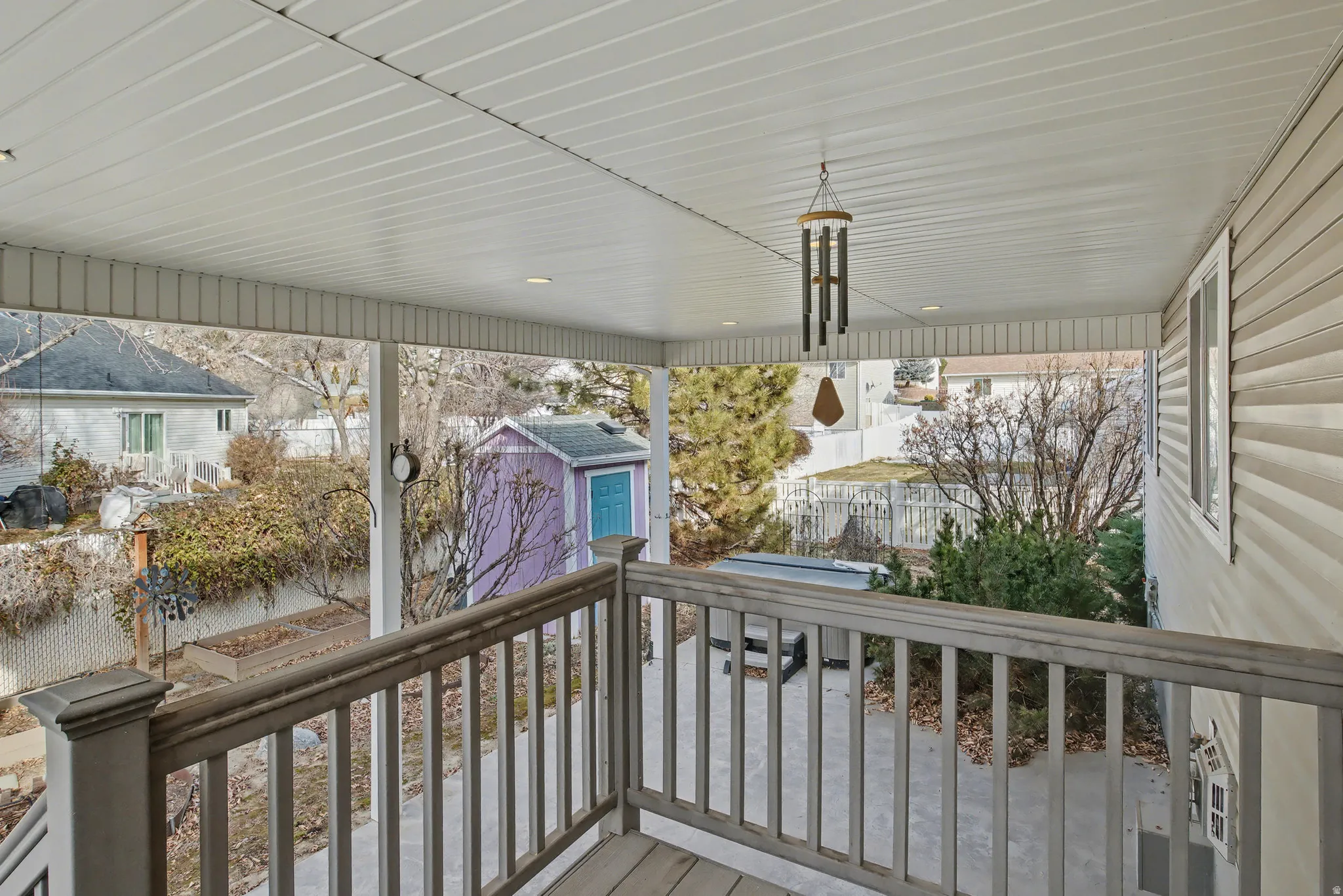 Backyard covered patio. and view of the storage shed.