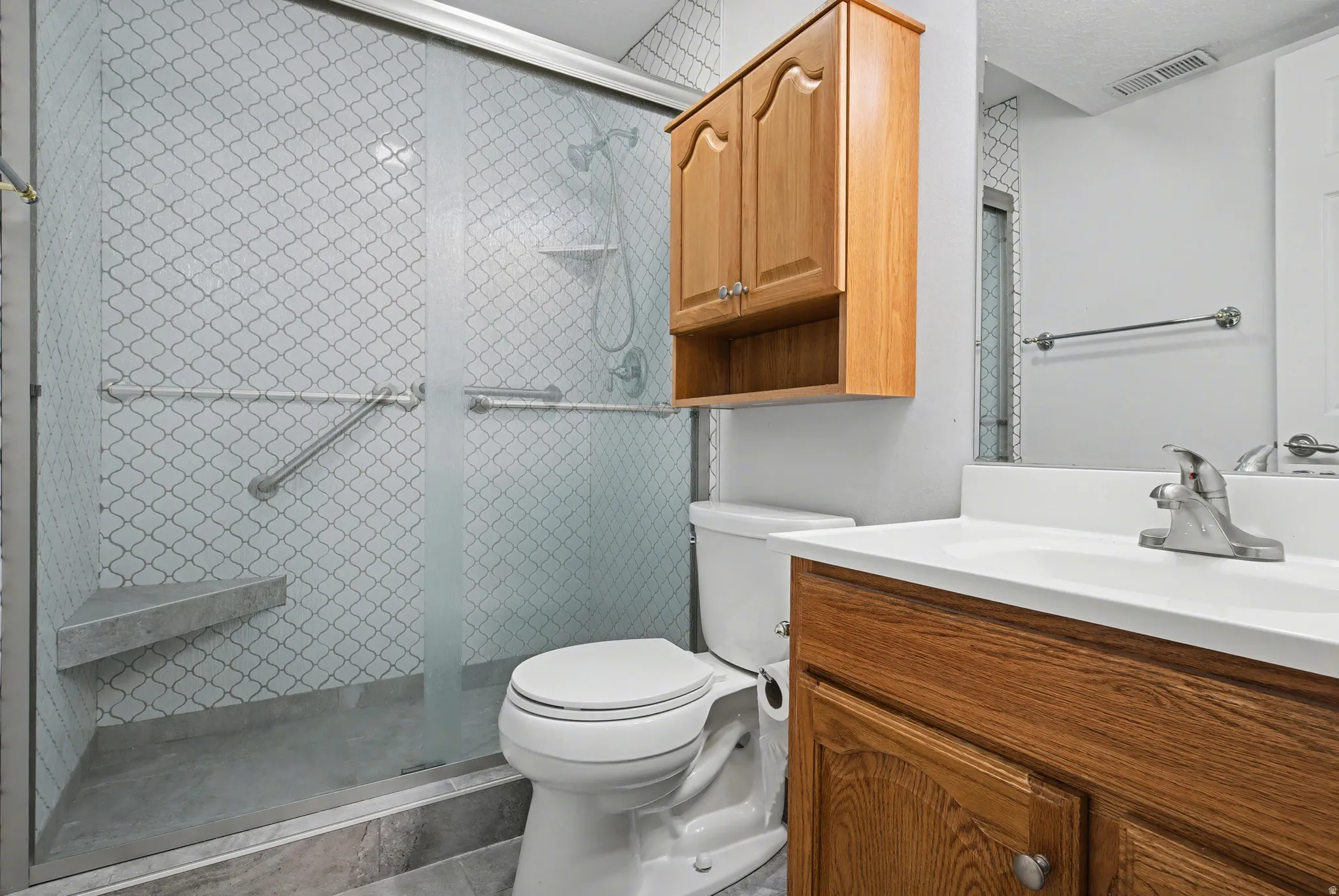 Basement bathroom with oversized walk in shower.