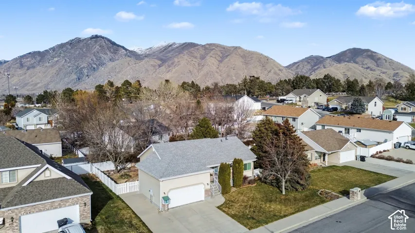 View of mountain backdrop featuring nearby suburban area