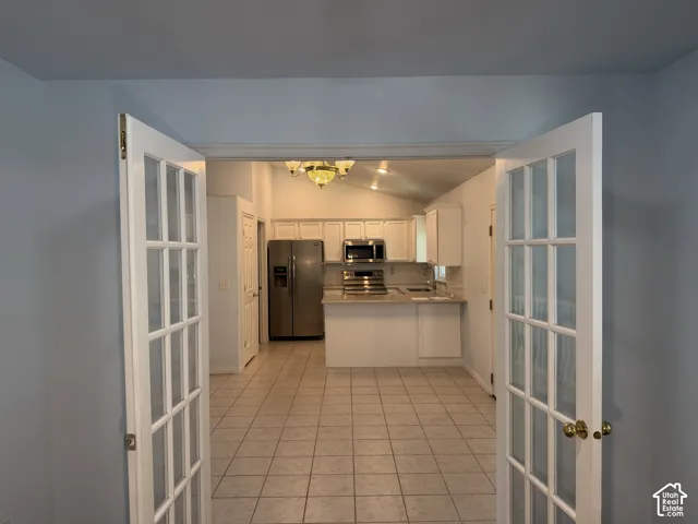 French Doors into this room make it a great home office or library.  This room is off the kitchen.