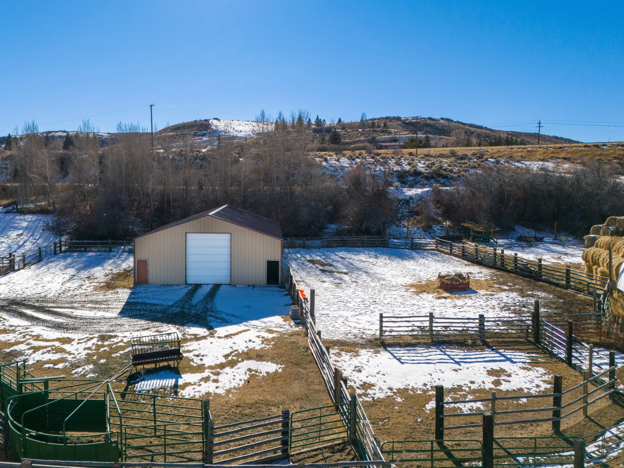 Dock with a mountain view, a rural view, and an outbuilding
