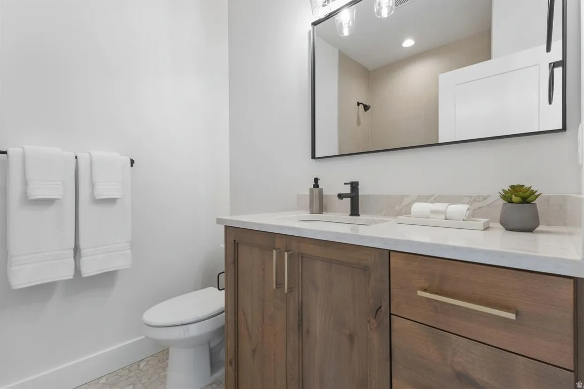 Full bathroom featuring vanity and a shower