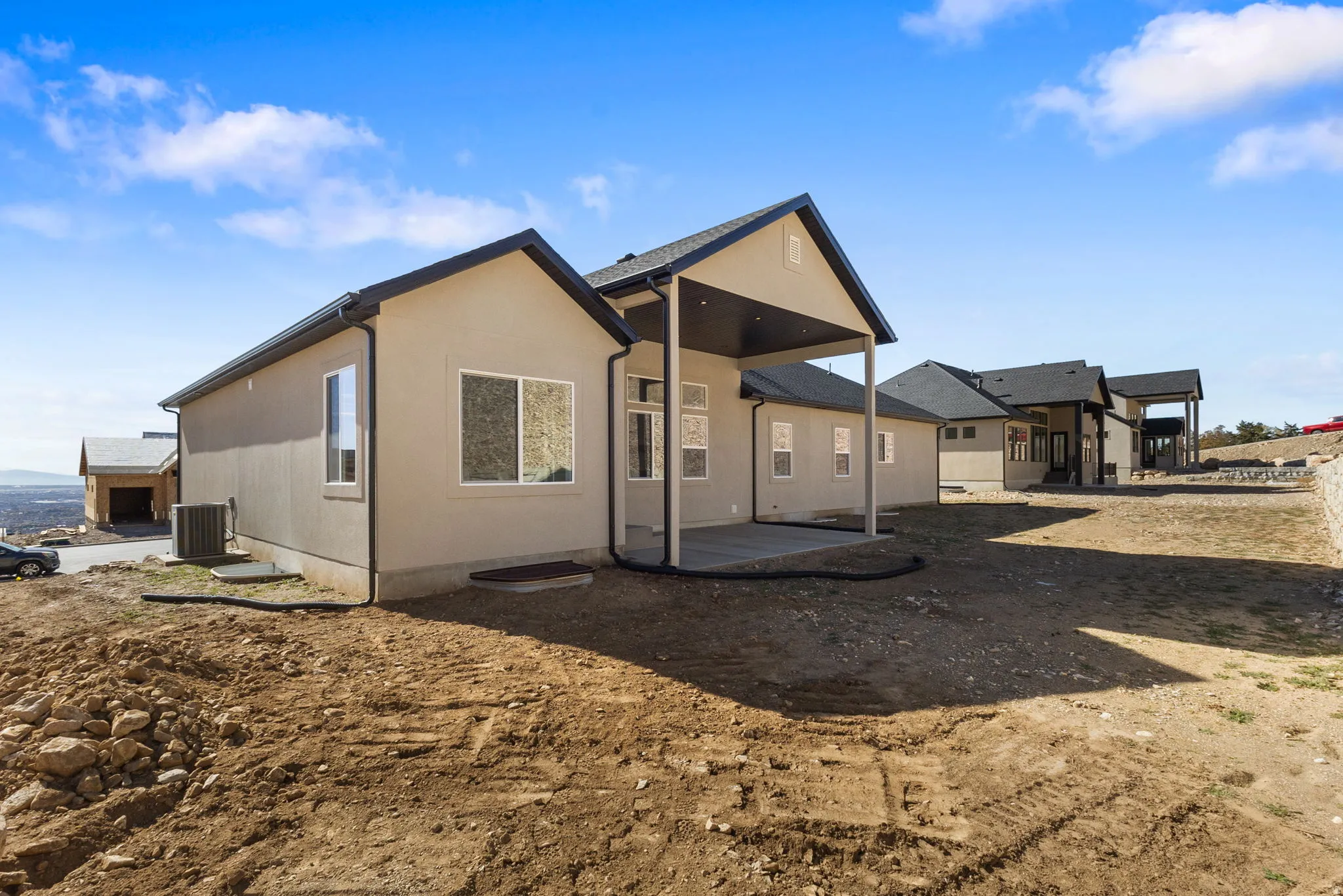 Back of house featuring a patio area and stucco siding