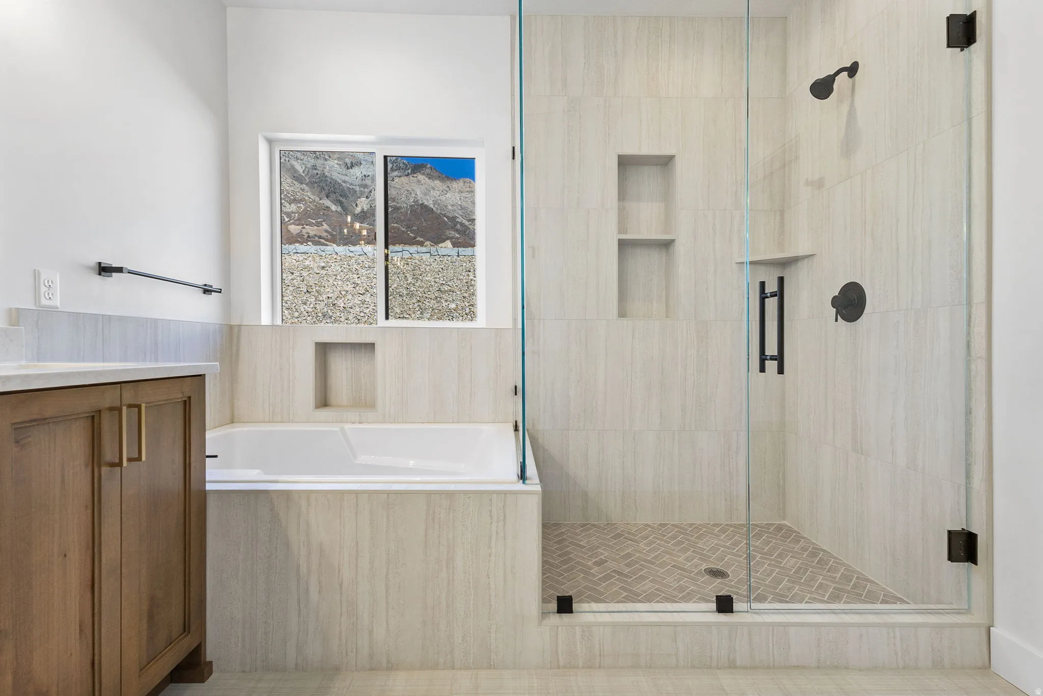 Full bathroom featuring vanity, a bath, and a stall shower