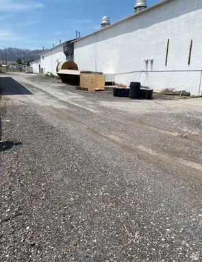 View of asphalt street featuring a mountain view