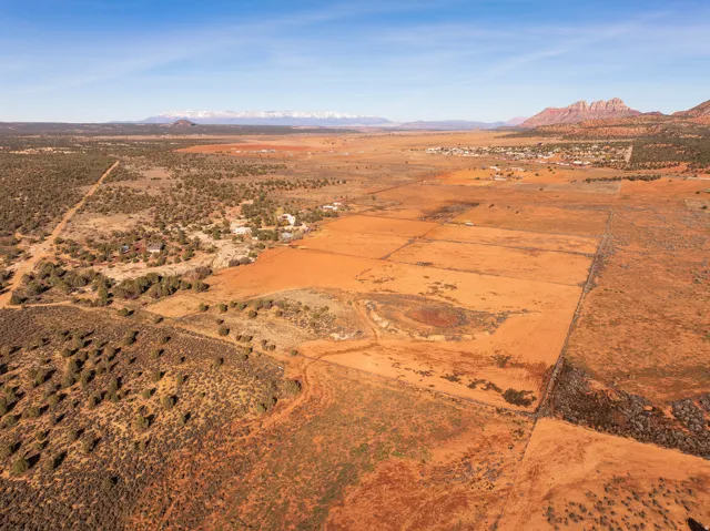 Overview of rural landscape with a mountainous background and a desert landscape