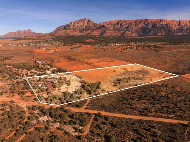 Overview of rural landscape with property boundaries highlighted and mountains