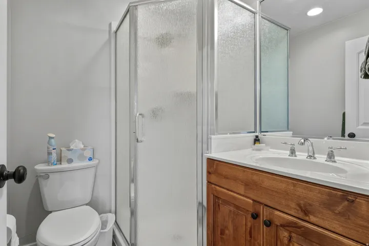 Bathroom with vanity and a shower stall