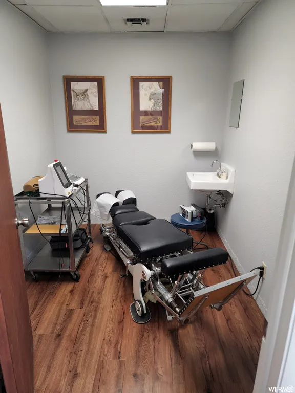 Miscellaneous room featuring a paneled ceiling and a sink