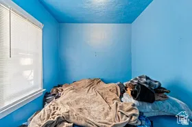 Bedroom featuring a textured ceiling