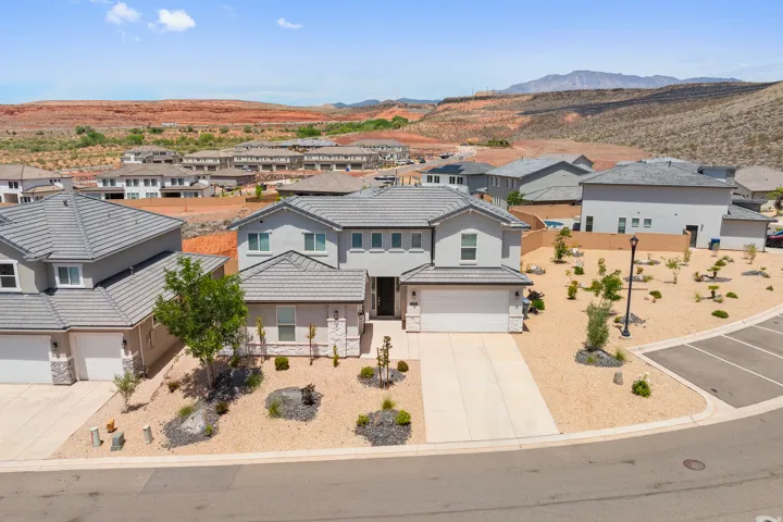 Aerial view of residential area with a mountainous background