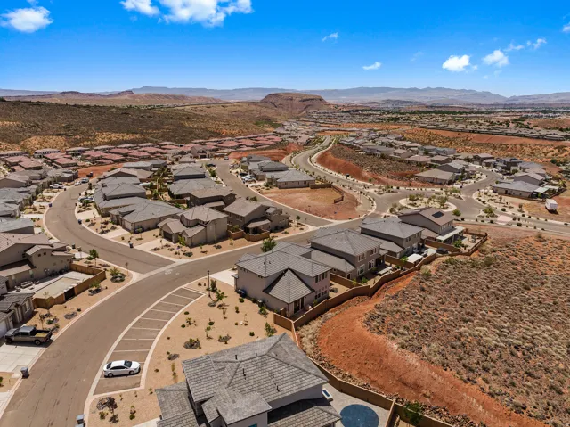 Aerial perspective of suburban area with a mountain backdrop