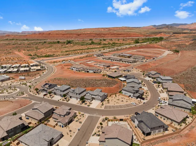 Aerial view of property's location featuring nearby suburban area and rural landscape