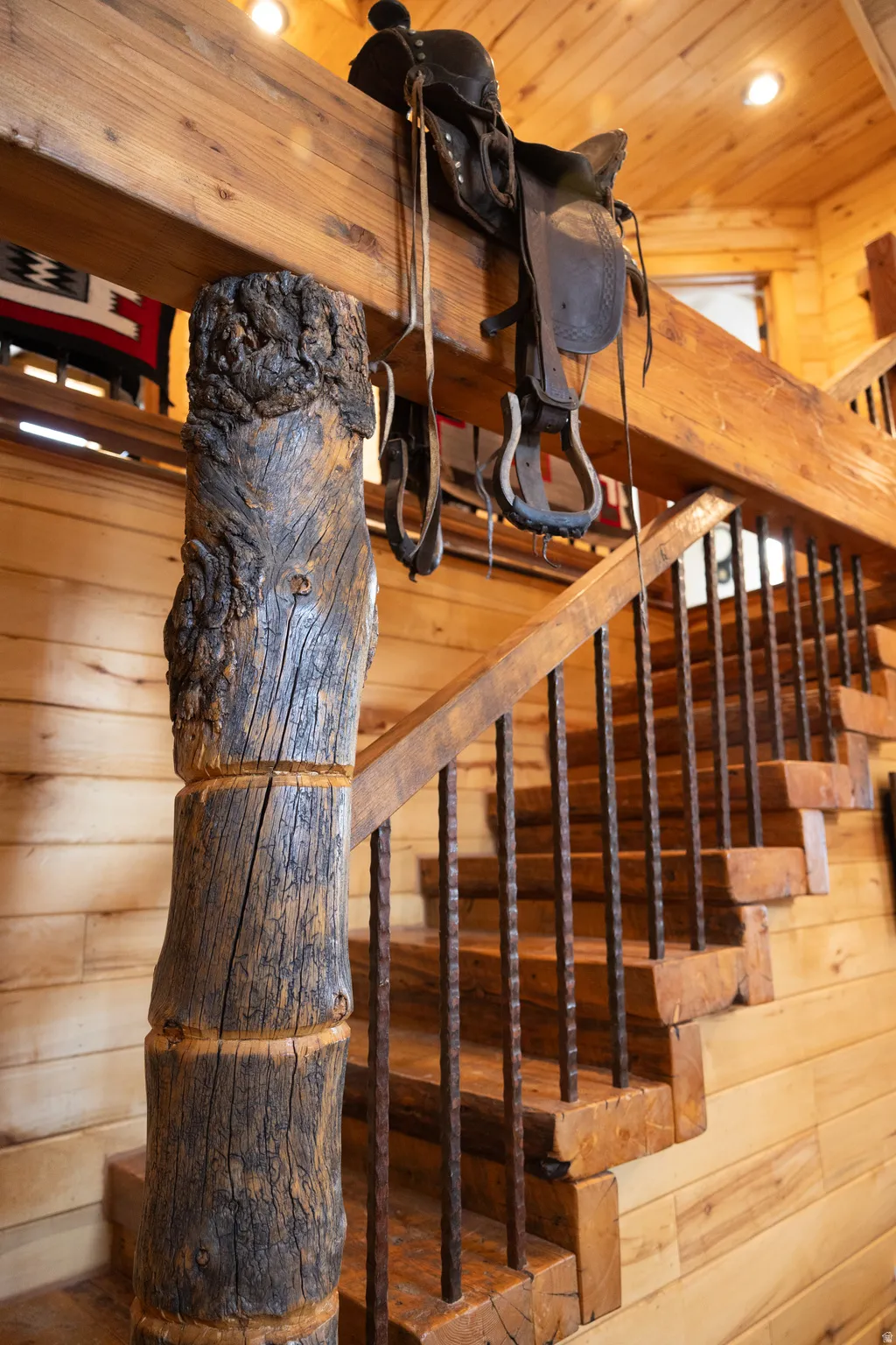 Stairs featuring wood ceiling and wood walls