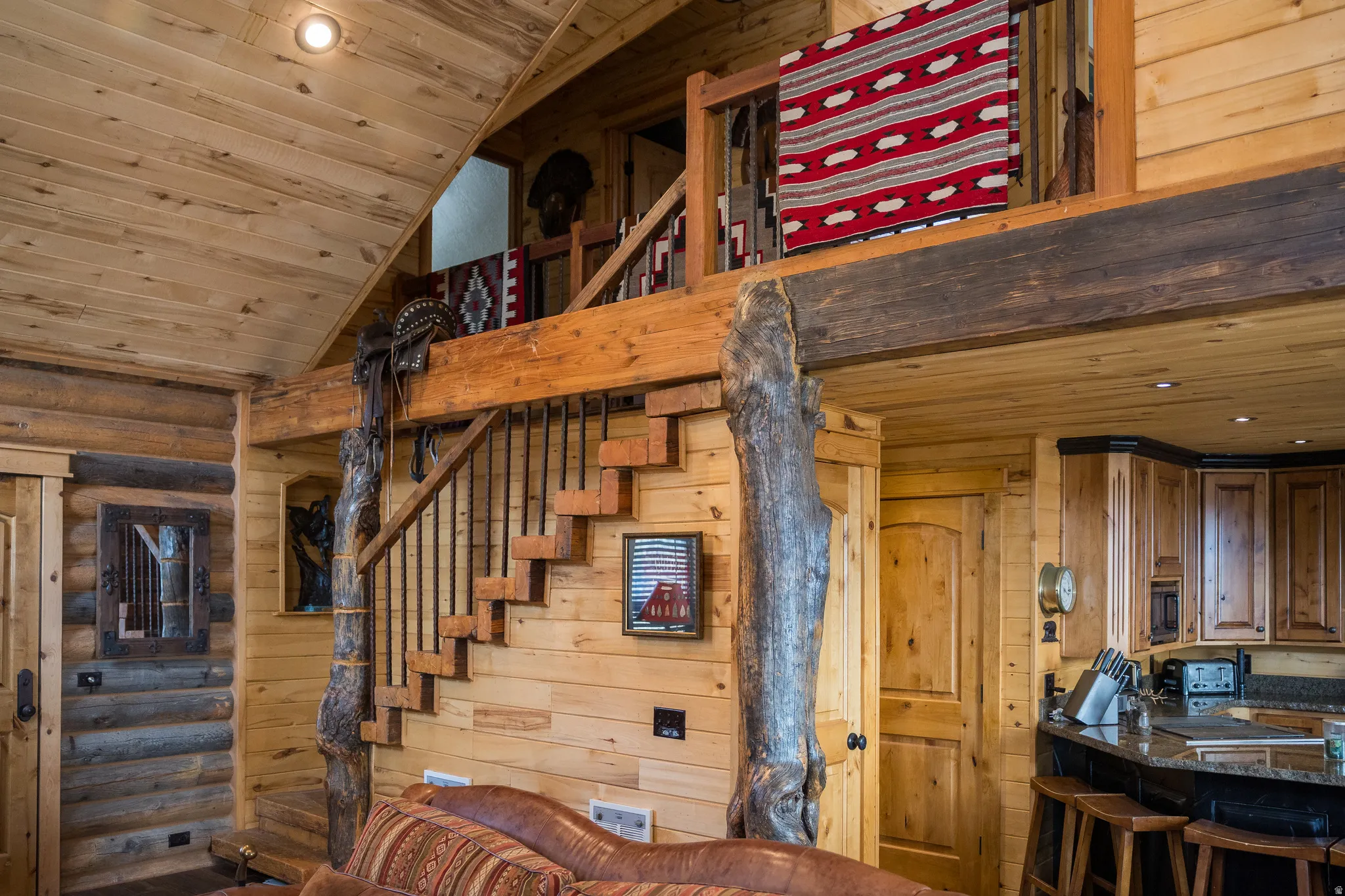 Stairs with wood ceiling, wooden walls, and recessed lighting