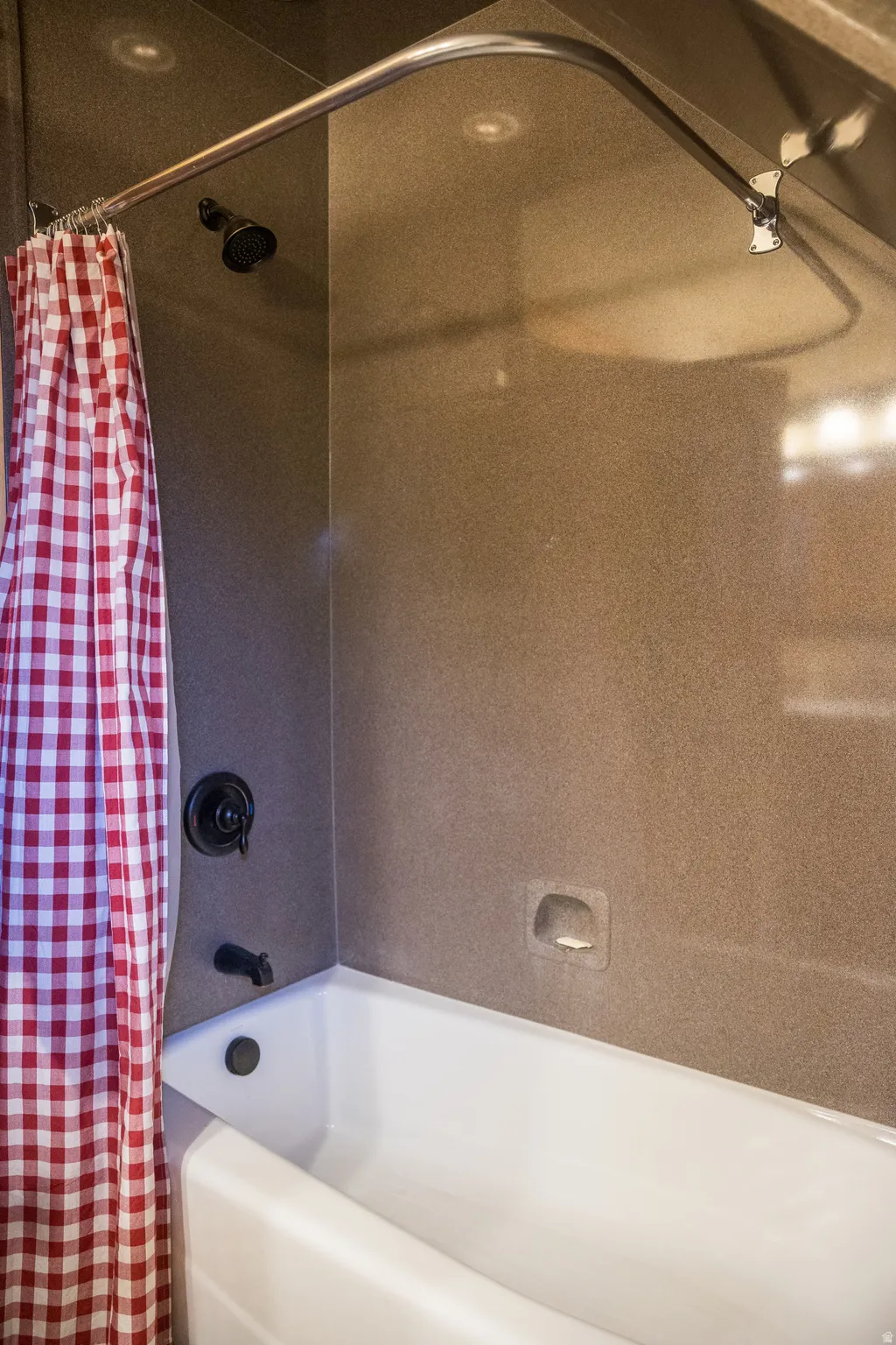 Full bath featuring shower / bath combo with shower curtain