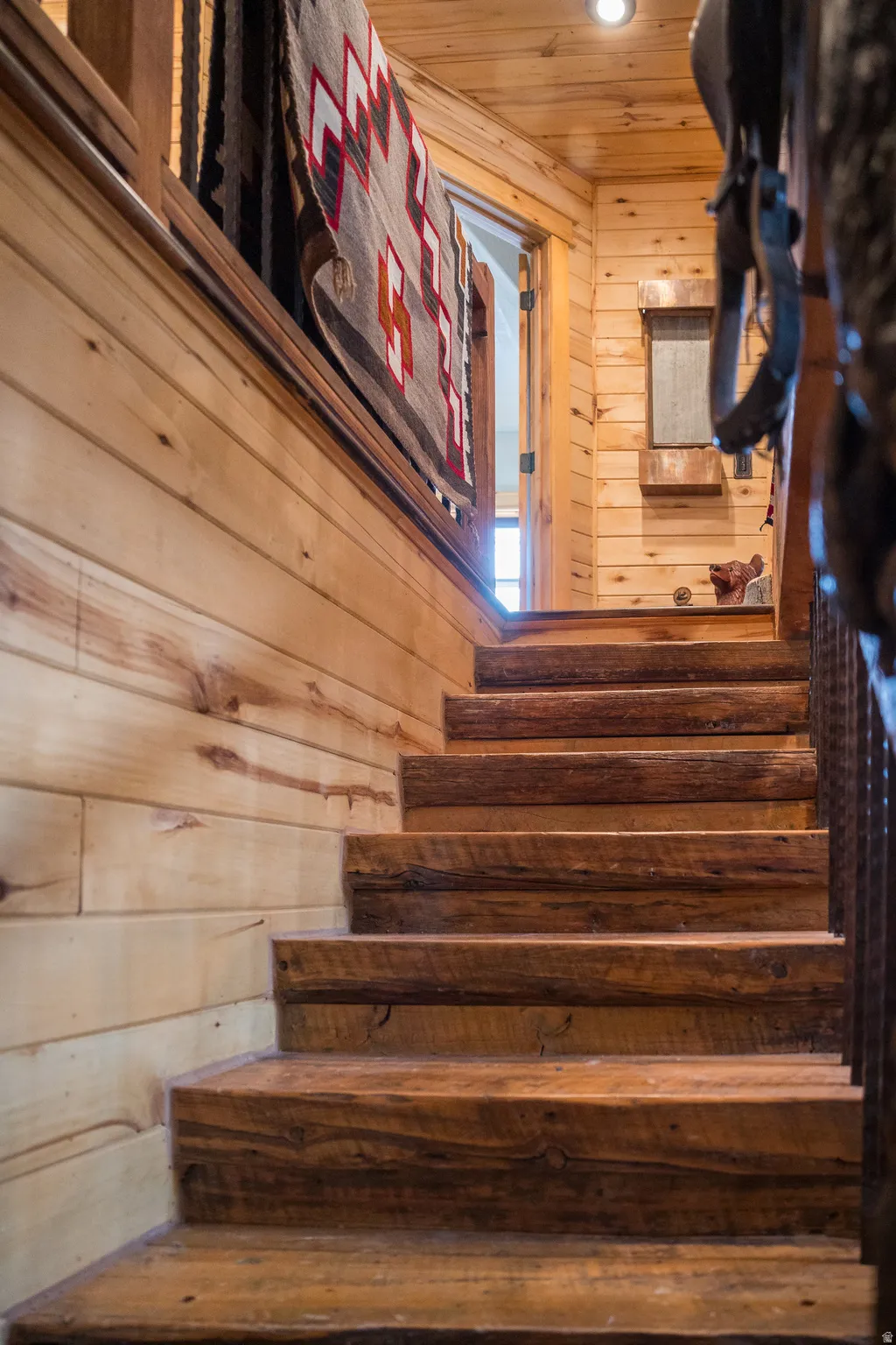 Stairway with wooden walls and wooden ceiling