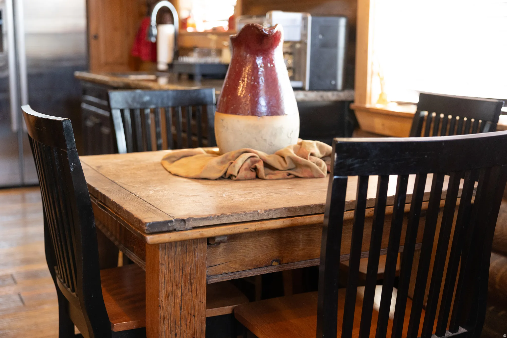 Dining space featuring plenty of natural light and wood finished floors
