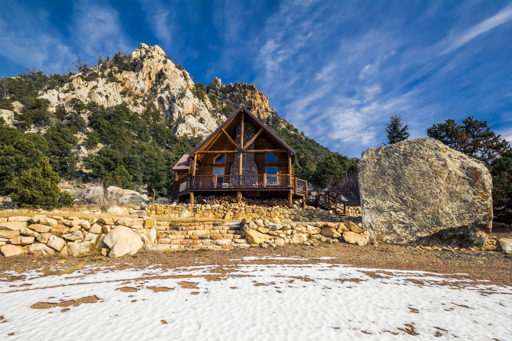 View of front of house featuring a deck with mountain view