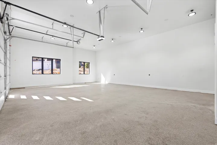 Spare room featuring light colored carpet