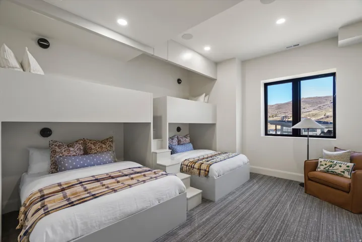 Carpeted bedroom featuring recessed lighting and a mountain view