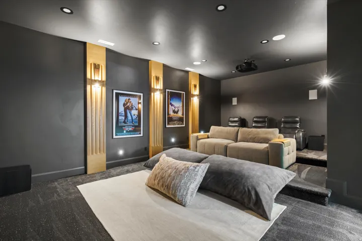 Home theater room with carpet and recessed lighting