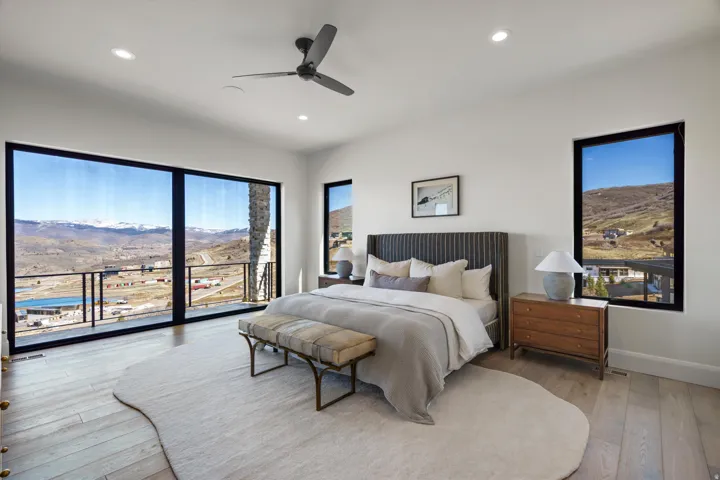 Bedroom featuring a mountain view, access to outside, light wood-style floors, a ceiling fan, and recessed lighting