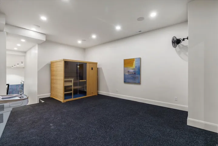 Gym featuring a relaxing sauna and recessed lighting