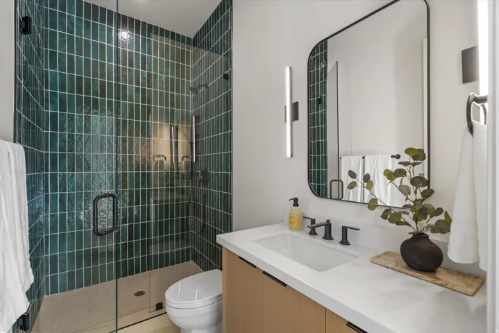 Full bath featuring vanity and a stall shower