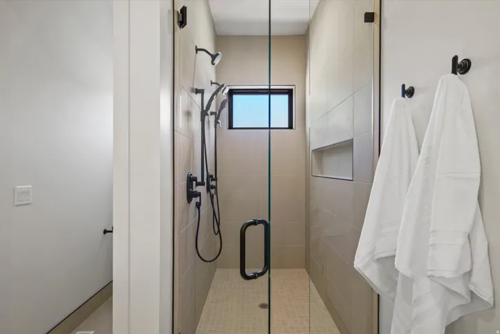 Full bathroom featuring a shower stall