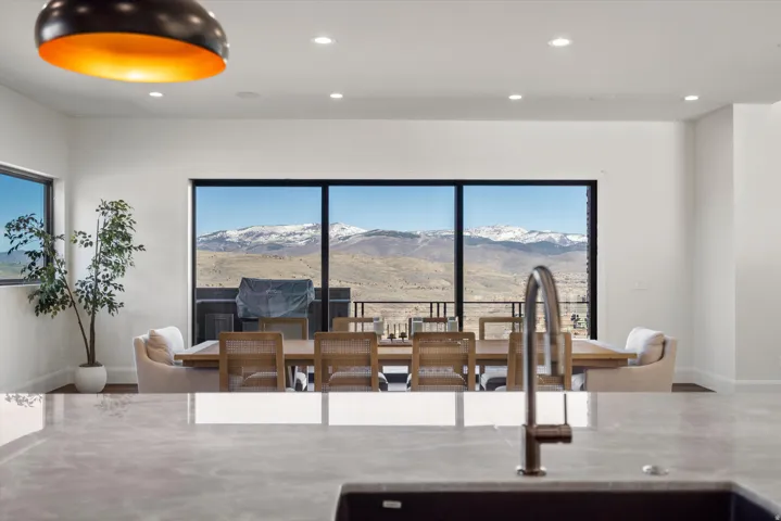 Dining space featuring a mountain view and recessed lighting