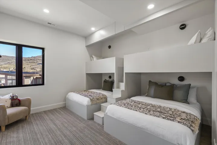 Carpeted bedroom featuring baseboards and recessed lighting