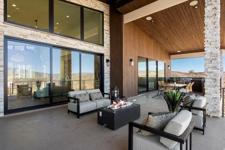 View of patio / terrace featuring an outdoor fire pit, outdoor lounge area, and a mountain view