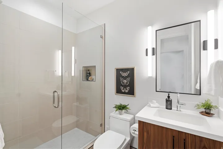Bathroom featuring vanity and a stall shower