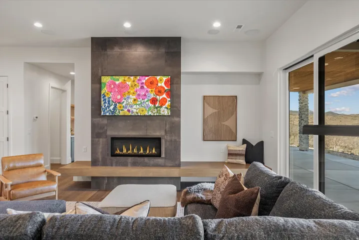 Living area featuring a fireplace, wood finished floors, and recessed lighting